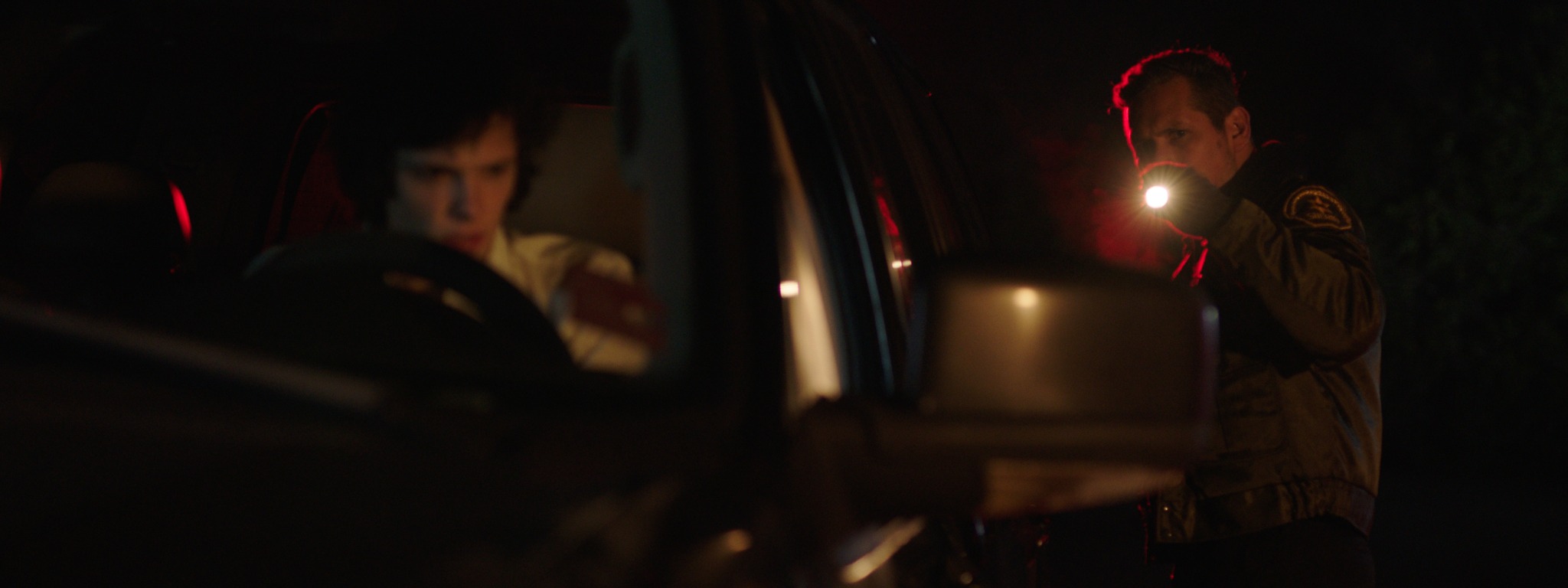 Red scene still: police stop at night